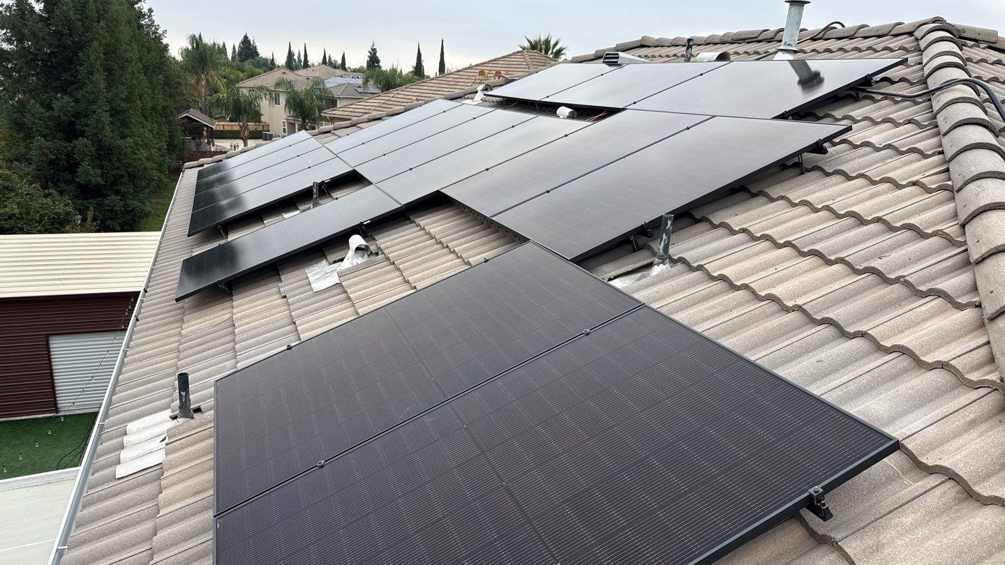 Full 39-panel JA Solar array across multiple roof planes — Fresno, CA